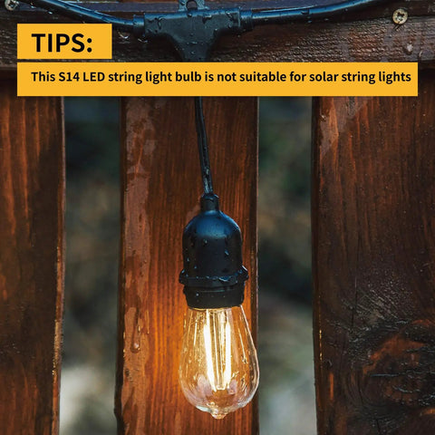 Outdoor 24 Pack Dimmable Shatterproof S14 LED Replacement String Light Bulb hanging on wooden post, Edison style, warm glow