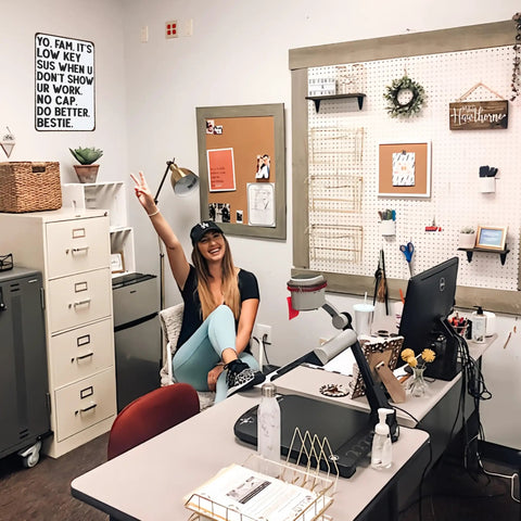 Office with person and 'Its Low Key Sus When U Dont Show Ur Work Tin Sign For Home Classroom Study Room Wall Decor Humorous Gift' visible