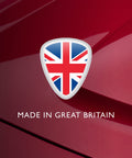 Union Jack shield with 'MADE IN GREAT BRITAIN' text on a red car surface, Bird Dropping Wipes 10 Pack For Cars Quick, Safe Exterior Clean Up That Softens Droppings Before Wiping One Time Use Sachets Gentle On All Exterior Surfaces Fast Mess Free Car Cleaning.