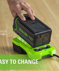 Person placing battery on 40V Li Ion Battery Charger With Diagnostic LED And Wall Mount For Fast Charge Of 2.0Ah Packs In 60 Minutes