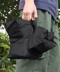 Person holding Range Ready Outdoor Shooting Rest Bags With Front And Rear Support For Rifle And Shotgun Sandbag Stand Holders
