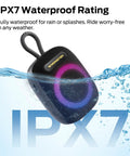 Outdoor Bluetooth Speaker with IPX7 Waterproof Rugged Build in water, showcasing compact design, RGB lights, and loop handle.