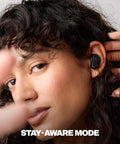 Woman wearing Dime Evo Wireless Earbuds Bluetooth Headphones with Noise Isolating Fit up to 36 Hours Battery Life True Black