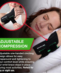 Woman wearing a black fitted wrist brace for pain relief and solid support with carpal tunnel tendonitis and arthritis one-hand cinch adjustment.