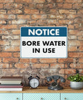 Water In Use Aluminum Heads Up Sign 8x12 UV Printed Notice Plaque For Home Farms Businesses And Facilities Indoor Outdoor Water Supply Zones High Visibility Safety Marker on brick wall