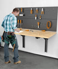 24 Inch Black Heavy Duty Folding Shelf Brackets on garage wall with tools and workbench, max load 550 lb, garage ready