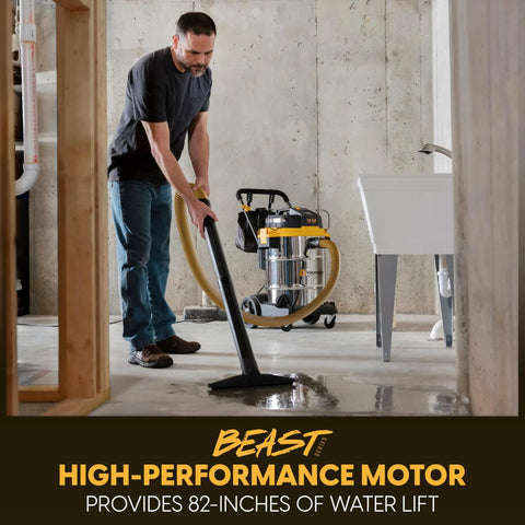 Man using 14 Gallon Wet And Dry Shop Vacuum With 65 Peak Horsepower Motor And Stainless Steel Tank on wet floor.