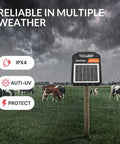 Portable Solar Fence Charger With Day Night Mode Up To 10 Miles Of Coverage displayed on farm field with cows in rain
