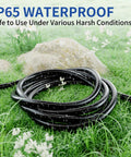 Triple Outlet Outdoor Extension Cord 10 Ft Waterproof Grounded Power Strip For Garden Patio Camping 16 Gauge 3 Conductor SJTW 13 Amp 125 Volt 1625 Watt ETL Listed Black shown coiled on grass with water droplets, highlighting IP65 waterproof feature.