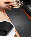Person installing Heavy Duty Tool Box Drawer Liner Kit 16 Ft By 16 In Black PVC Non Slip Mat in tool chest