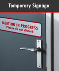 Sign on door reading 'Meeting in Progress, Please Do Not Disturb,' illustrating temporary signage.