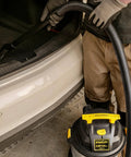 Beast Of A 5 Gallon Wet Dry Shop Vacuum With 4 Peak HP Motor Stainless Steel Tank Portable Vac in use at car trunk
