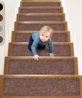 Child on stairs with No Slip Stair Treads 8 By 30 Inches 15 Pack With Pre Applied Adhesive Indoor Carpet Safe For Elders Kids And Dogs