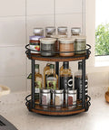 Rotating Spice Rack Two Tier Lazy Susan Organizer For Kitchen Countertop with spices and bottles organized on a brown wood turntable.