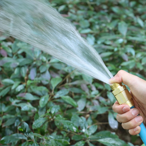 Five Eighths Inch Garden Hose Connector Repair Fittings Set in use spraying water over green plants