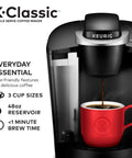 K Classic Single Serve Coffee Maker For K Cup Pods Black Finish With Removable Drip Tray and red mug