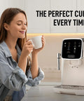 Woman enjoying coffee near automatic espresso machine with built in grinder and touch panel for barista quality coffee at home.