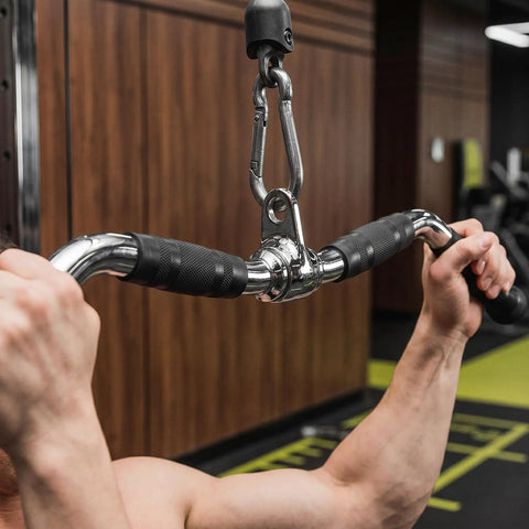 Person using Lat Bar Cable Machine Attachment With Full Rotation Rubber Grip 30 Inch Pulldown Bar in gym setting
