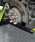 Pro Grade Wheel Alignment Tool Kit With Tape Measures, Heavy Duty Toe Alignment Plates installed on car wheel hub.