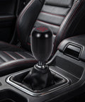 Upgrade Your Ride With This Sleek Kisa Angel 2 Piece Weighted Shift Knob Set For Manual Cars Featuring Ergonomic Grip, Anodized Finish, And Universal 8 10 12 Mm Adapter Kit For Smooth Gearing Action. Black weighted aluminum shift knob in manual car interior