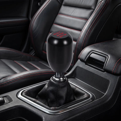Upgrade Your Ride With This Sleek Kisa Angel 2 Piece Weighted Shift Knob Set For Manual Cars Featuring Ergonomic Grip, Anodized Finish, And Universal 8 10 12 Mm Adapter Kit For Smooth Gearing Action. Black weighted aluminum shift knob in manual car interior