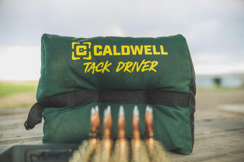 TackDriver Gun Bag With One Piece Construction And Non Marring Surface For Outdoor Range And Hunting on wooden table