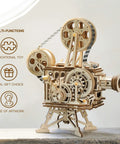 Vitascope 3D Wooden Puzzle Kit For Adults showing assembled vintage cinema projector model with gears and reels.