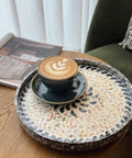 12 Inch Wooden Lazy Susan With Mother Of Pearl Inlay Smooth Spinning Turntable Serving Tray with coffee cup on wooden table.