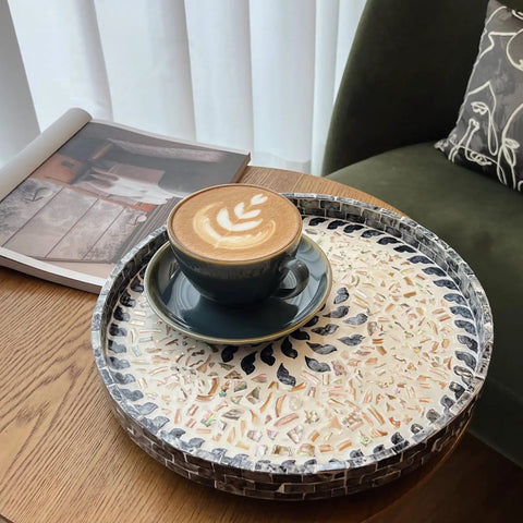 12 Inch Wooden Lazy Susan With Mother Of Pearl Inlay Smooth Spinning Turntable Serving Tray with coffee cup on wooden table.