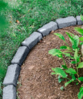Greystone Faux Stone Landscape Edging Kit for Lawn and Garden Borders 40 Pack, shown bordering a tree area with grass and mulch.