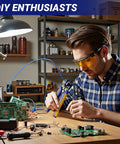 Man using Self Adjusting And Manual Wire Stripper Tool Set For 10 To 24 AWG Heavy Duty Electrical Strippers at workstation