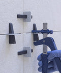 One Eighth Inch Tile Leveling System With 500 Clips For Lippage Free Tile And Stone Installations in use on wall tiles.