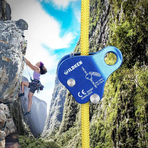 Blue Climbing Ascender Belay Device Rope Grab For Rock Climbing And Mountaineering with yellow rope in use on a cliff.