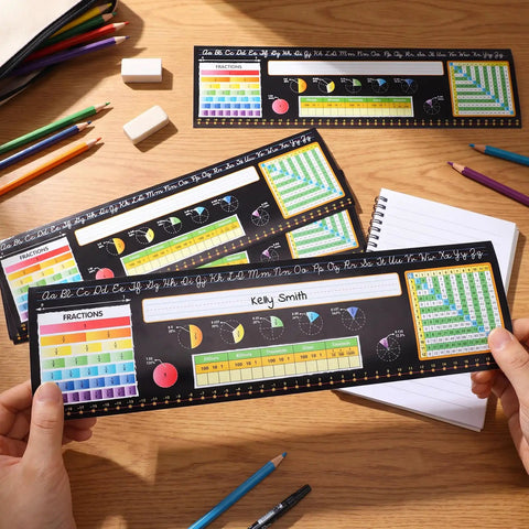 Hands holding Huge 48 Pack Chalkboard Style Self Adhesive Desktop Nameplates For Classroom Use with educational references.