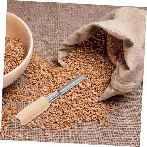 Stainless Steel Grain Sampler With Wooden Handle For Wheat And Rice Sampling next to bowl and sack of wheat on burlap