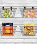 Slatwall baskets holding packaged snacks mounted on a slatted wall for organization and display