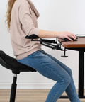 Two Pack Clamp Adjustable Armrests Transform Your Home Office Into A Hella Comfy Haven With Flexible 360 Rotating Elbow Support And Sturdy Steel Base Stand For Epic Desk Setups In Classic Black, shown on ergonomic chair.