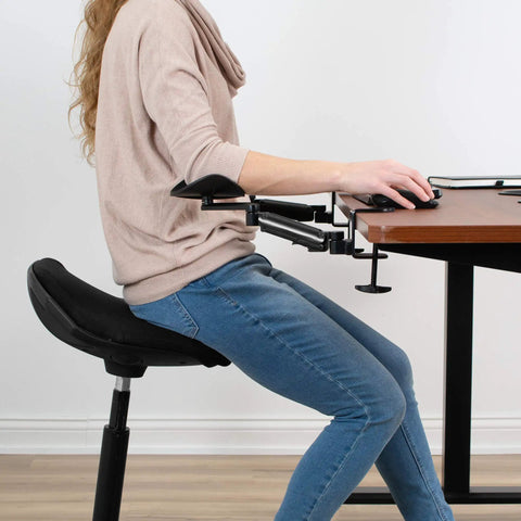 Two Pack Clamp Adjustable Armrests Transform Your Home Office Into A Hella Comfy Haven With Flexible 360 Rotating Elbow Support And Sturdy Steel Base Stand For Epic Desk Setups In Classic Black, shown on ergonomic chair.