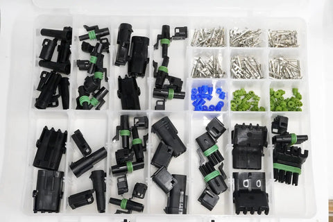 Ultimate Automotive Weather-Pack Connector Kit For 20 Amp Systems With Sealer Terminals And Housing For Male Female Quick Disconnect Splices Plus Wire Gauge Range From 10 To 20 Ga Ready For Any Rig Or Ride. Assorted black housings, terminals, and seals in organizer