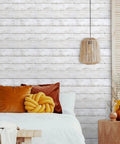 Room scene with Shiplap Peel And Stick Wallpaper White Wood Plank Vinyl Wrap for walls behind a bed and nightstand, DIY friendly