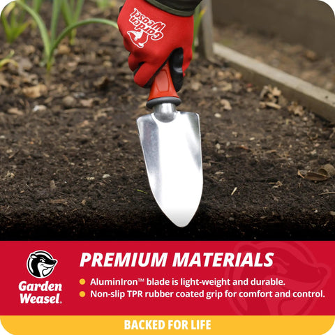 Pro Grade Heavy Duty Garden Trowel for Planting Digging and Cultivating with red handle in soil, close-up view