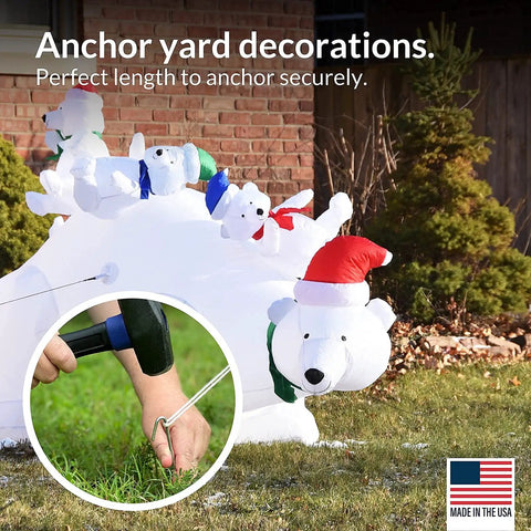 Person securing inflatable with 30 Pack Tent Stakes 9 Inch Galvanized Steel Ground Spikes With 1 Inch Hook Built Tough Rust Resistant 8 Gauge For Tents Fences Tarps Decorations Inflatables Outdoor Use Made In USA, image showing hand hammering stake into ground next to polar bear decoration.