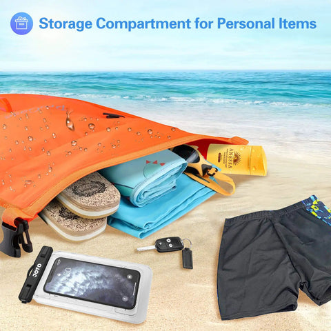 35L Swim Buoy Dry Bag Floating Backpack with personal items on a beach, showing storage ability and waterproof material.