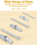 Hollow Wall Anchors Set 44 Pc Heavy Duty Toggle Bolts And Wing Nuts Kit For Drywall Hanging Pictures Curtains Plants Includes 1/8in 3/16in 1/4in Assorted Sizes shown in various sizes on wooden surface.