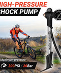 High Pressure Bike Shock Pump With Gauge For MTB Full Suspension 300 PSI 20 Bar Portable Manual Air Pump displayed outdoors with a cyclist