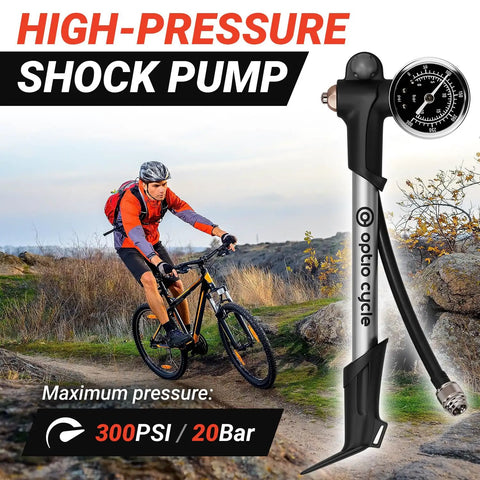 High Pressure Bike Shock Pump With Gauge For MTB Full Suspension 300 PSI 20 Bar Portable Manual Air Pump displayed outdoors with a cyclist