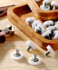 Game Changing 16 Piece 19 Mm Three Quarter Plastic Drawer Rollers With Precision Ball Bearing For Slick Cabinet Sliding And Kitchen Furniture Easy No Sweat Replacement in a wooden tray.