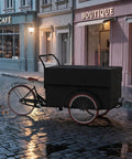 Kickstart Your Curbside Hustle With This Heavy Duty Outdoor Coffee Cart Featuring A Wide Canopy Sun Shade And Smooth Rolling Wheels For Mobile Vending Or Pop Up Market Sales, black cart on cobblestone street.