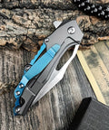 Folding Pocket Knife With D2 Steel Blade And Lightweight T6 Aluminum Alloy Handle on a wooden surface