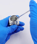 Blue-gloved hands using pick tool on fitting with Pro Grade Hydraulic O Ring Kit With 420 Pieces For ORS ORFS Fittings